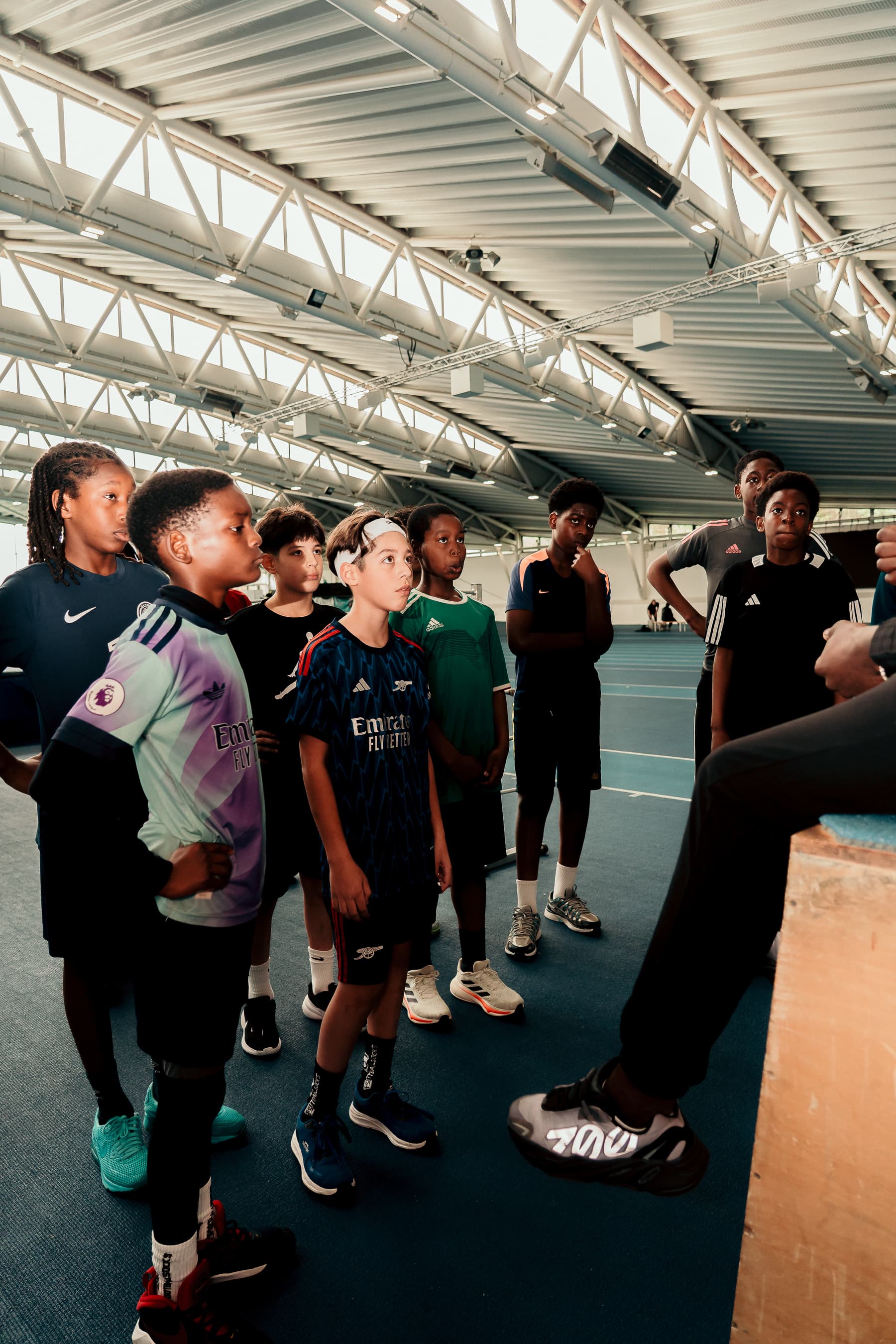 Group of children playing football together in London